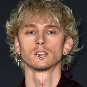 Machine Gun Kelly wears the Fossil Ear Cuff in his mouth
